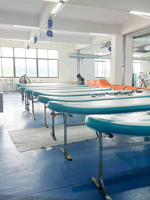 Team of certified SUP technicians conducting final inspection in ISO-compliant production zone